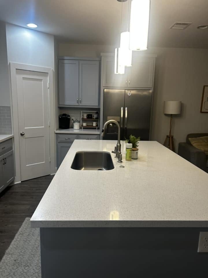 A kitchen island with a clear, polished counter